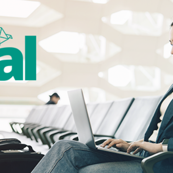 woman at the airport on a laptop with the Teal product logo