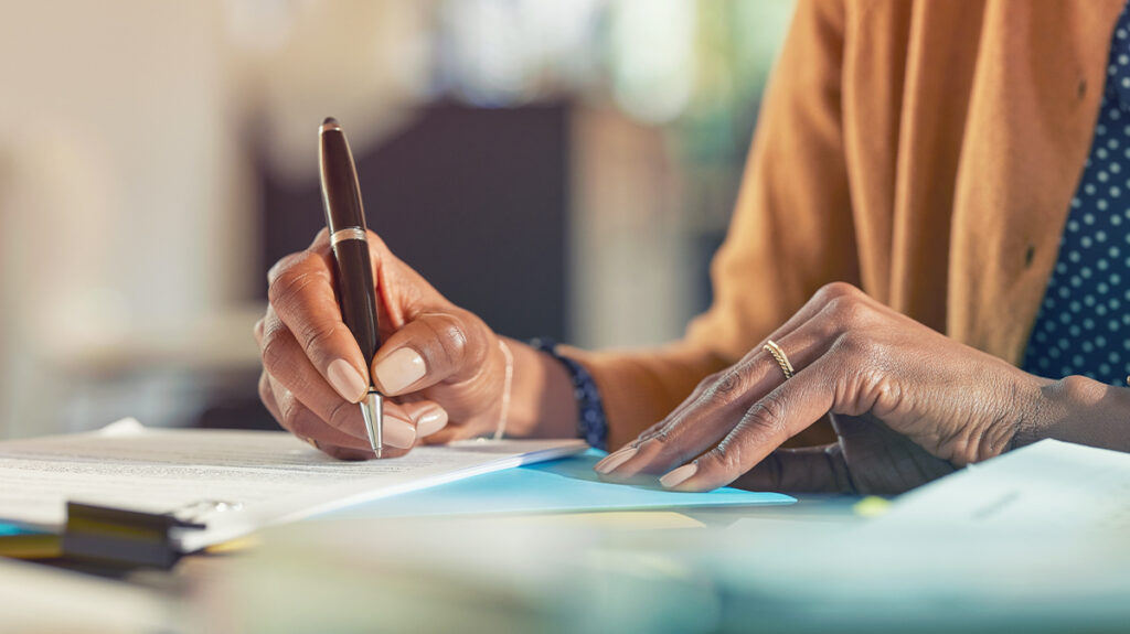 Woman looking over procurement documents 